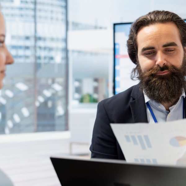 financial-advisor-guiding-young-adult-trading-shares Ayfie